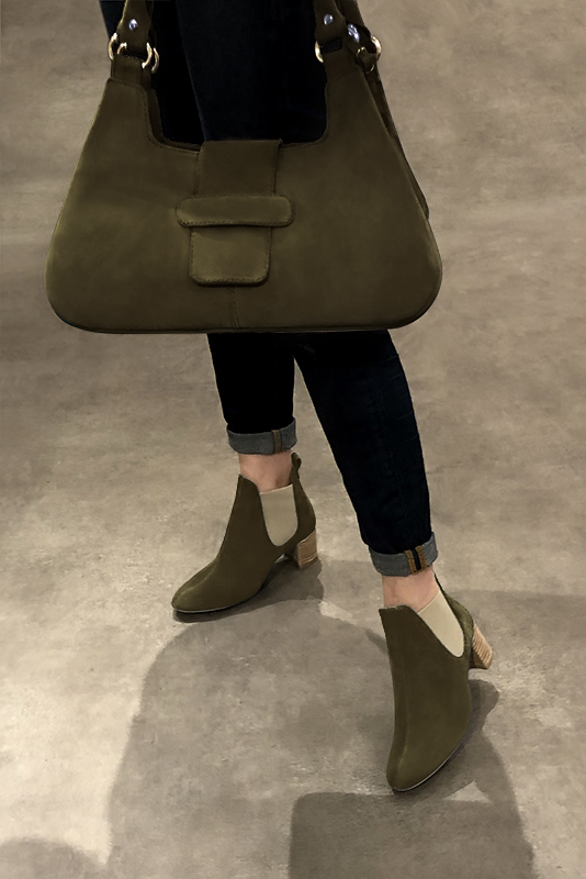 Khaki green and off white women's ankle boots, with elastics. Round toe. Medium block heels. Worn view - Florence KOOIJMAN